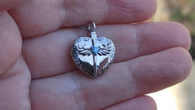 video of heart keepsake urn necklace in hand