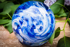 Ashes in glass orb for rememberance of people and pets