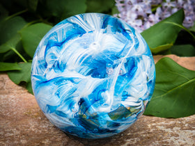 Ashes in glass orb for rememberance of people and pets