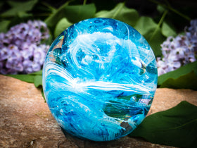 Ashes in glass orb for rememberance of people and pets