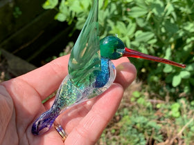 Dichroic glass hummingbird with cremation ash