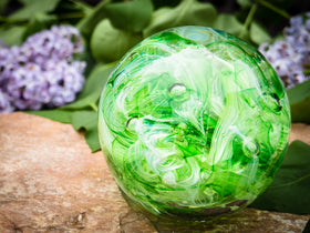 Ashes in glass orb for rememberance of people and pets