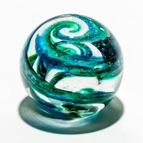 paperweight with cremation ash ocean on white