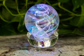 dichroic orb with cremation ash on light stand