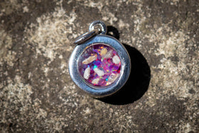 Dainty Silver Circle Pendant, with purple and magenta crushed opal, sitting on stone surface. Dainty Necklace, Small Necklace, Tiny Necklace, Silver Necklace for Ash, Necklace for Ash, Simple Necklace for Ash, Cremation Jewelry
