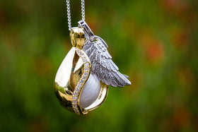 Gold plated Angel Tear pendant with diamond accents and a silver angel wing charm