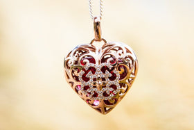 Cremation Jewelry Pendant with Glass Heart Holding Cremains