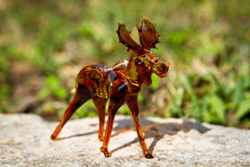 glass moose with ashes