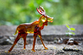 glass moose with ashes