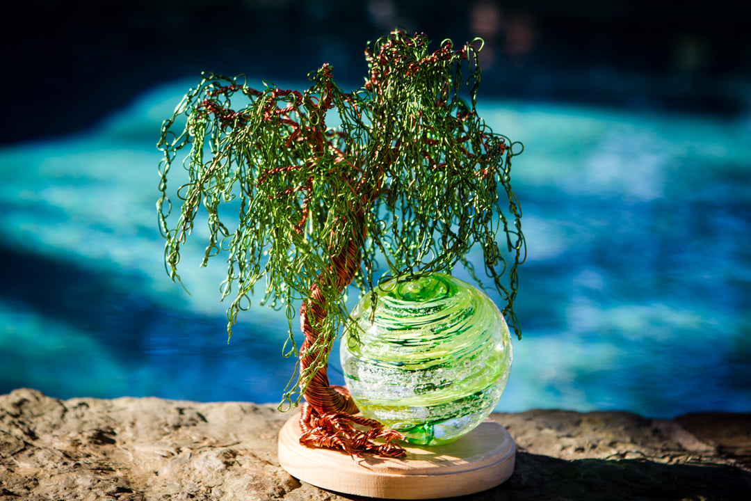 Weeping Willow Tree of Life with a lime green Tranquil Swirl Orb on a wooden stand