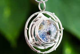 caged galaxy pendant with cremation ashes