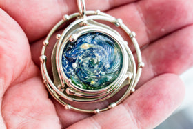 caged ocean pendant