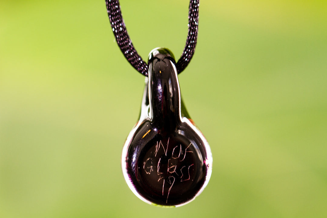 Holographic Moon and Stars ash pendant in dark glass on an adjustable cord