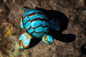 glass turtle with cremation ashes