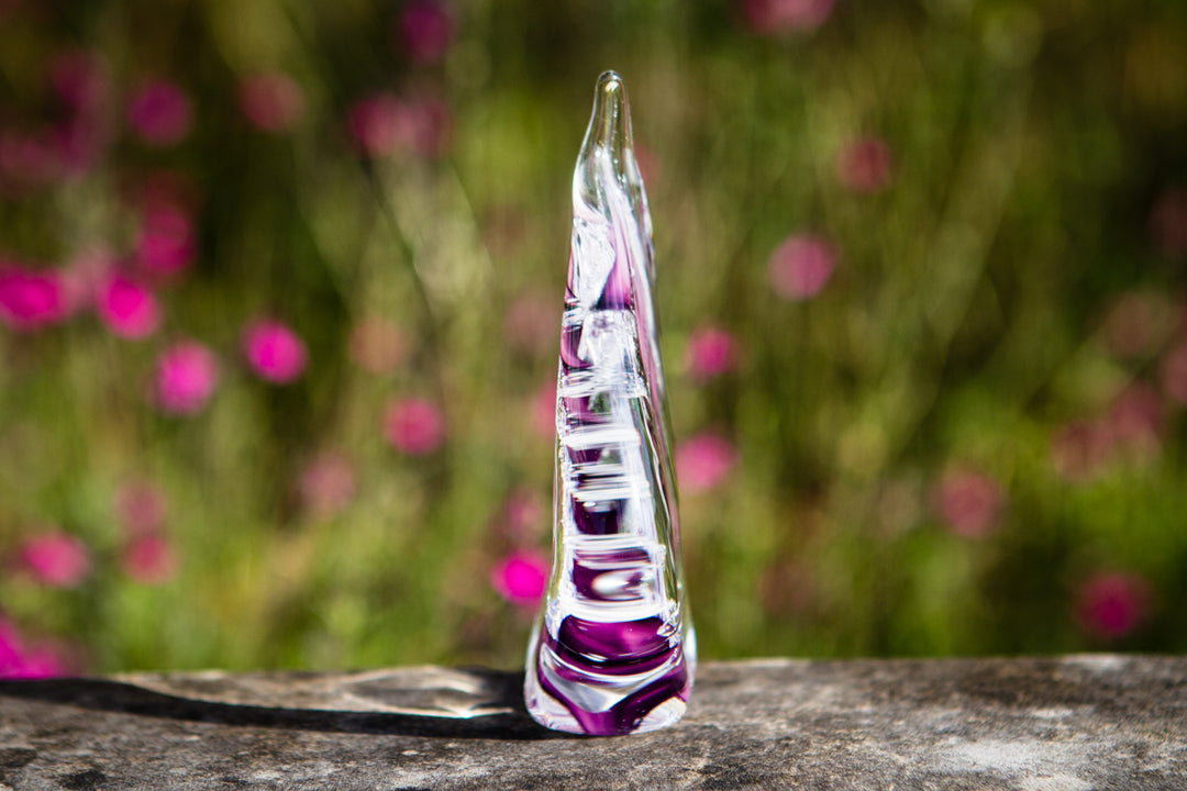 glass flame with cremation ash from pets and people