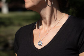 word pendant worn