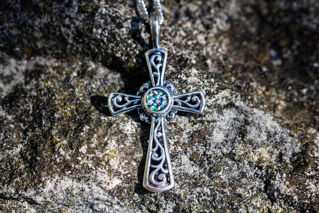 Cross Pendant, with blue and teal crushed opal, sitting on stone surface. Silver Cross Necklace, Cross Memorial Jewlery, Silver Necklace for Ash, Silver Jewelry for Ash, Memorial Jewelry, Religious Jewelry for Ash