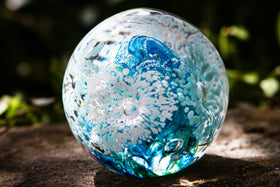 glass orb with cremation ash