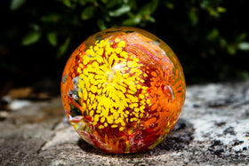 glass orb with cremation ash