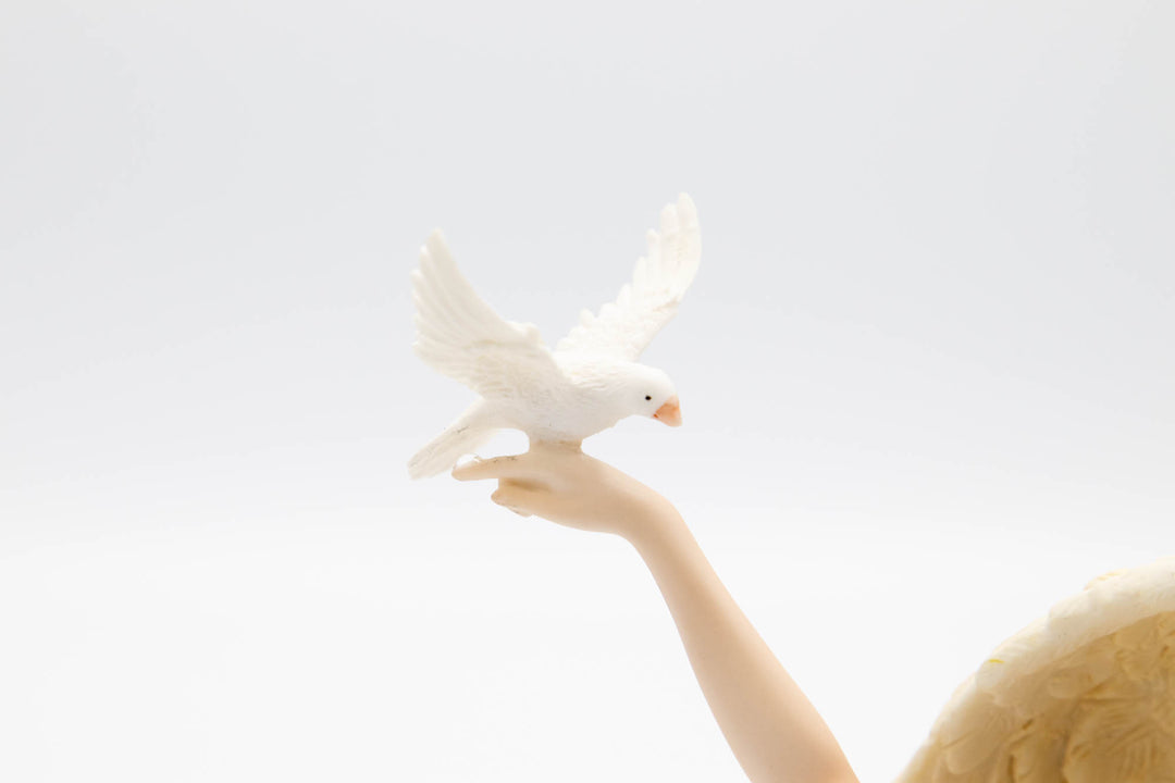 angel with dove figurine