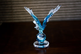 angel wing sculpture with ashes in glass