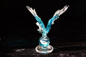 glass angel wings with ashes in glass