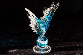 angel wings with ashes in glass
