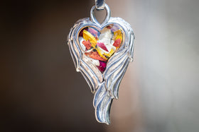 angel wing heart pendant with funeral flowers