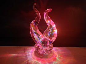 ashes in glass flame with light base