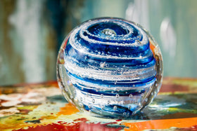 Glass paperweight with cremation ash from people and pets