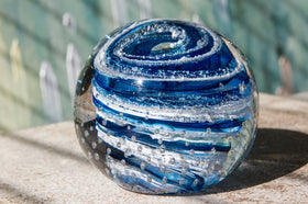 Glass paperweight with cremation ash from people and pets