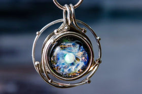 caged galaxy pendant with ash