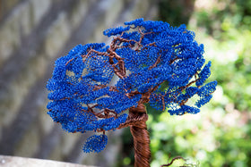 colorful tree of life memorial by brenda made of wire and wood base