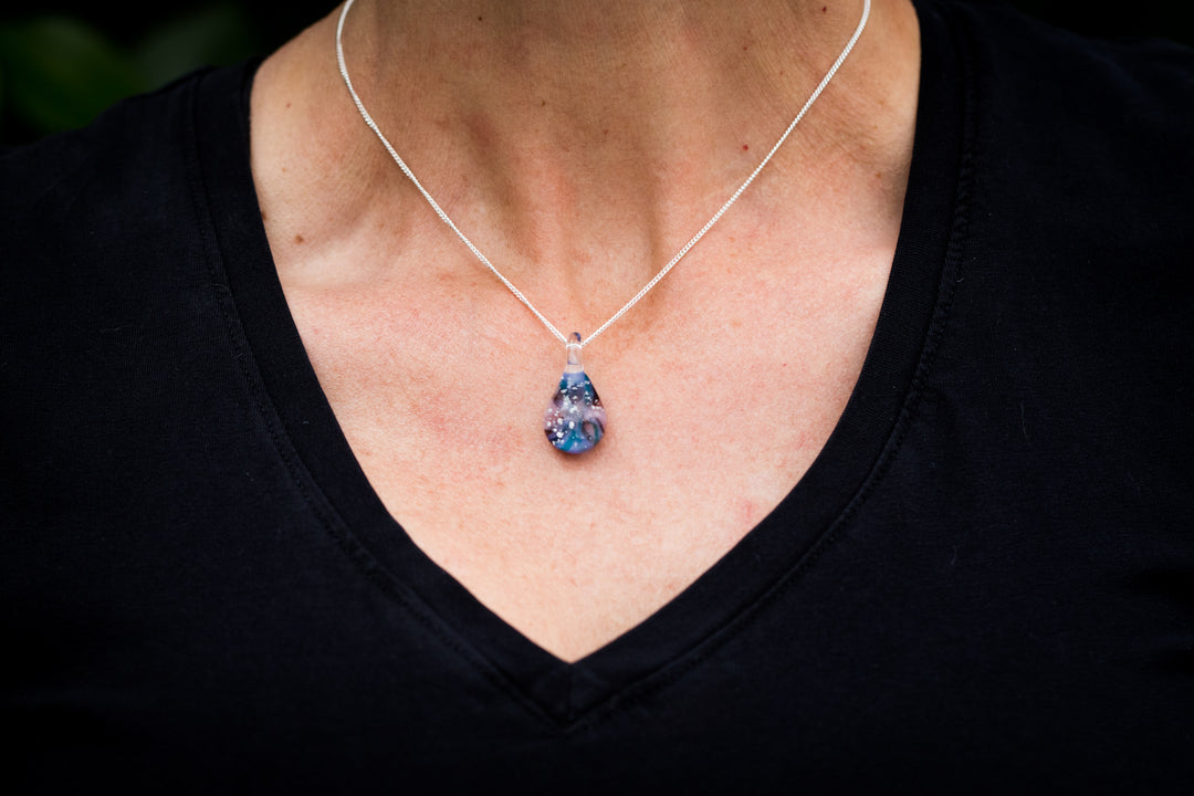 cremation jewelry pendant blue swirl with cremation ashcremation jewelry pendant blue swirl with cremation ash worn