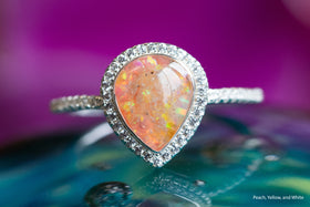 Sterling Silver Bedazzled Pear Opal Ring, (in white pink and yellow) sitting atop a glass surface. Sterling Silver Ring for Ash, Silver Ring for Cremation Ash, Remembrance Jewelry, Jewelry for Ash