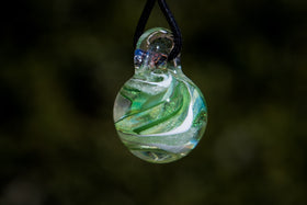 dichroic ball with cremation ash in green
