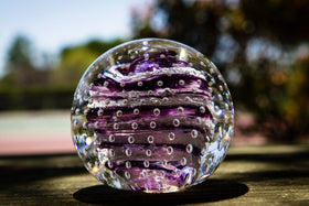 Glass paperweight with cremation ash from people and pets