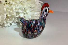 glass hen with ashes