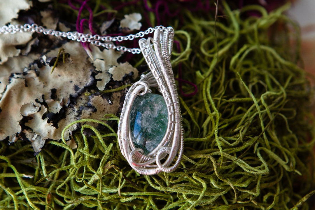 Wire wrapped glass pendant with cremation ash