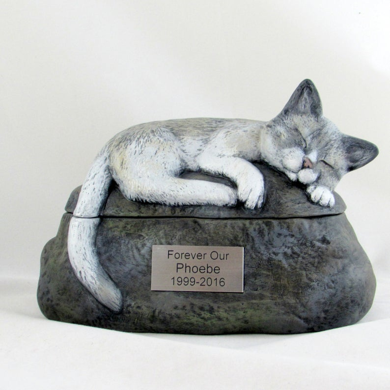 Two piece hand painted ceramic cat urn with a sleeping cat on a rock lid and a metal plaque