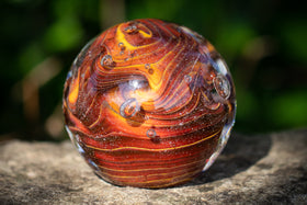 lava glass orb with cremation ashes