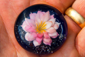cremation ash in glass lotus paperweight