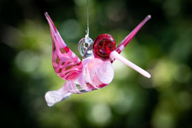 pink hummingbird with cremation ash