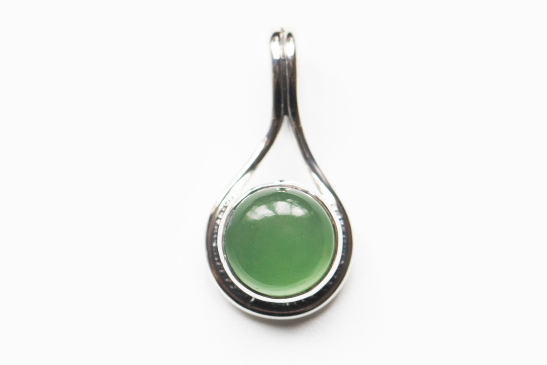 Stone Swirl Drop pendant in sterling silver with a round green cabochon set in a curved teardrop frame