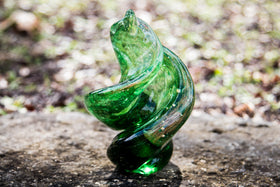 glass sculpture with cremation ash and dichroic glass in green
