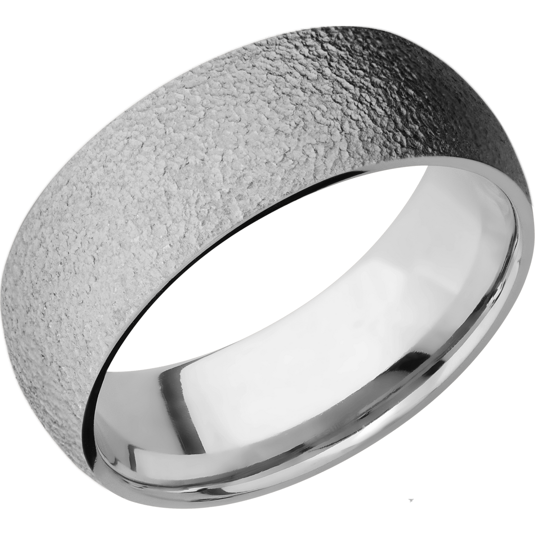 Close-up of a textured wide titanium ring with rough exterior and polished interior