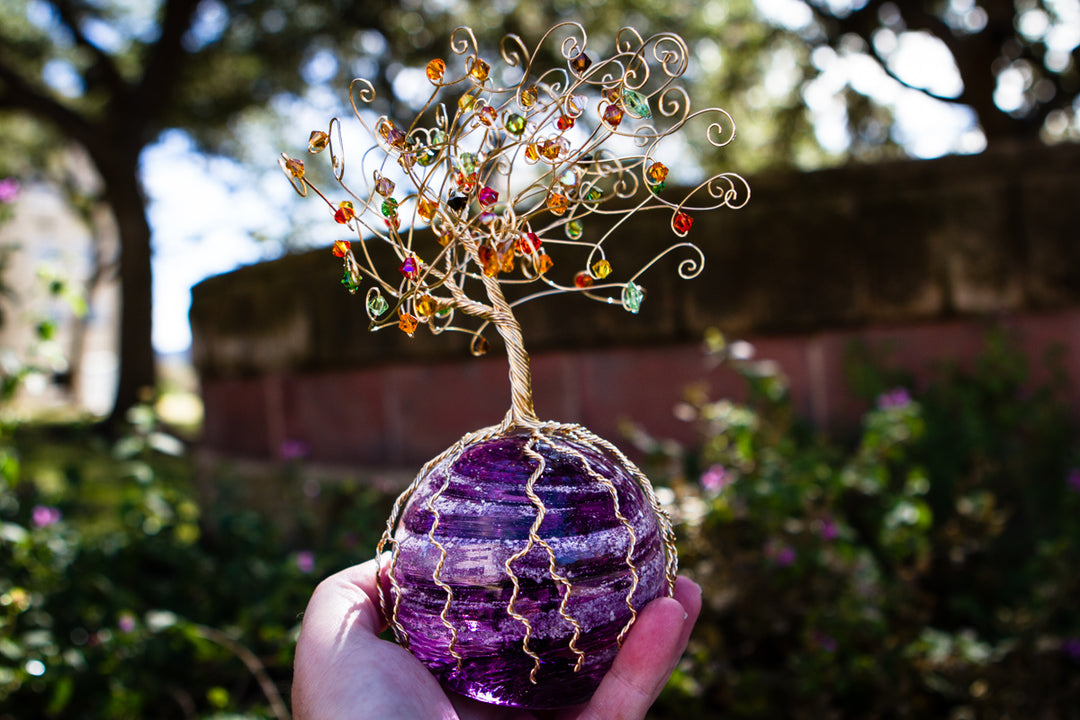 Golden Sparkle Tree of Life sculpture with crystal beads perched above a purple orb base