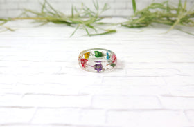 wildflower ring with cremains from pets and people on stonework